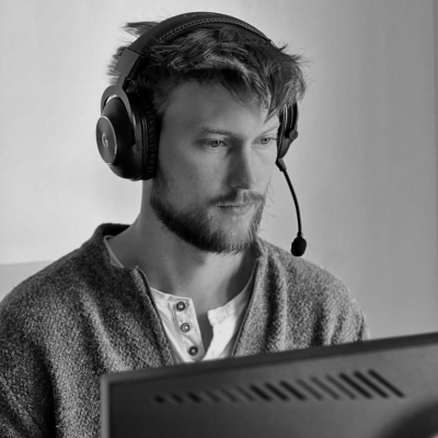 Man wearing headphones at desk